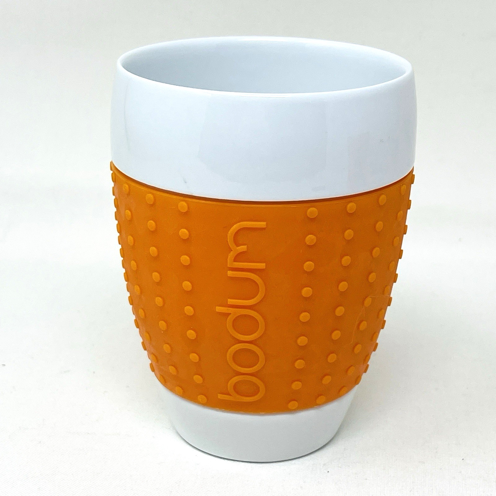Bodum Pavina Thermal Mug Porcelain Ceramic Orange Silicone Textured Sleeve 12 oz