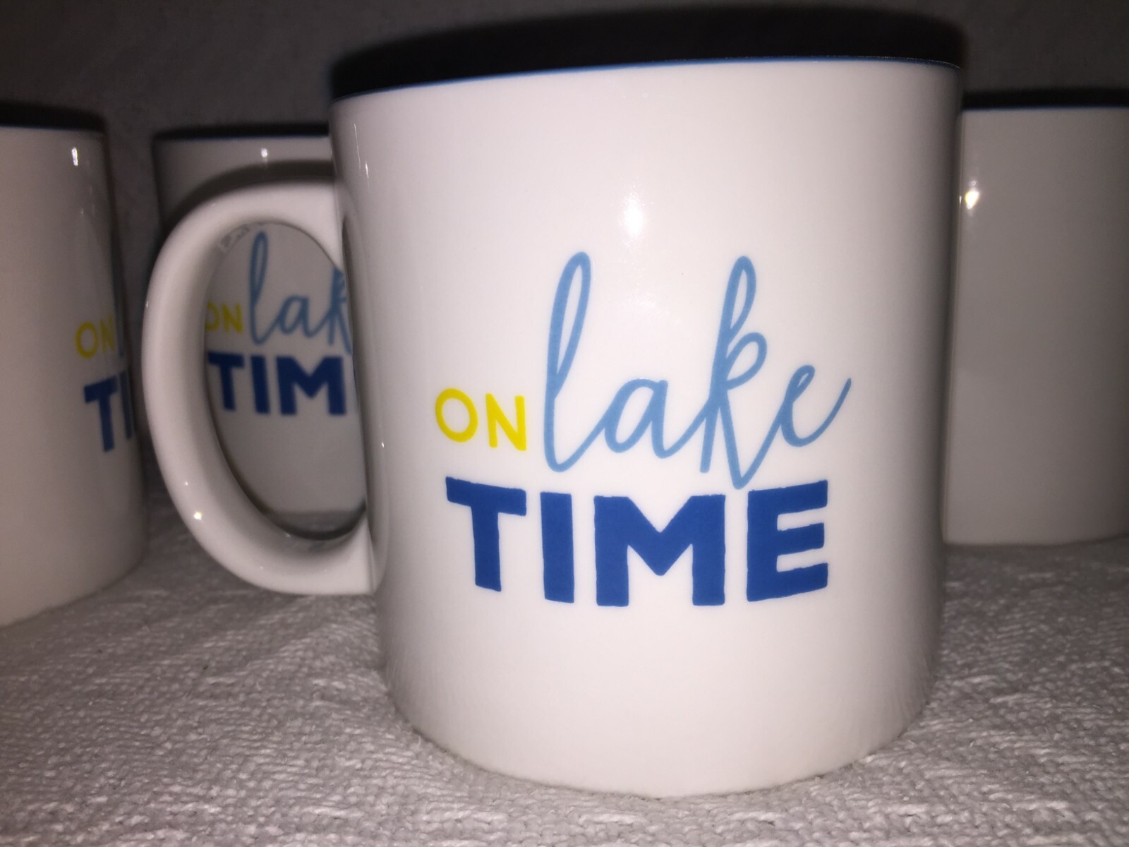 Set of 4 Clay Art 18 oz “On Lake Time” White and Blue Handle Coffee Mugs F159787