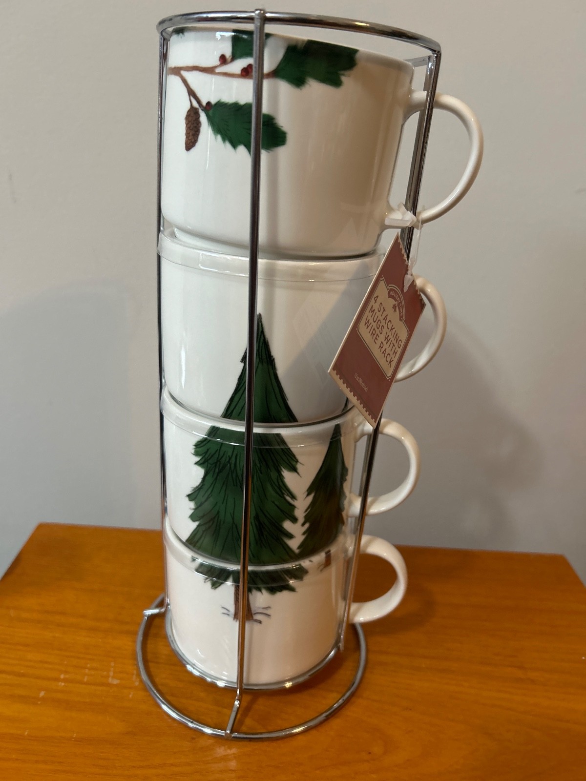 Holiday Time 4-piece stacking mug set includes a metal wire rack for storage.