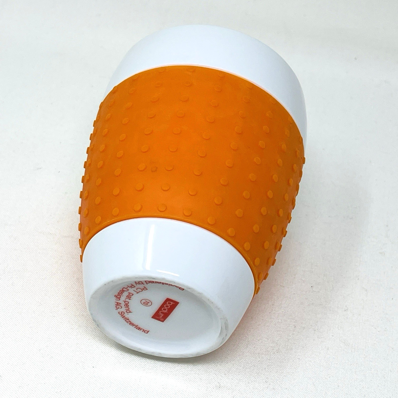 Bodum Pavina Thermal Mug Porcelain Ceramic Orange Silicone Textured Sleeve 12 oz