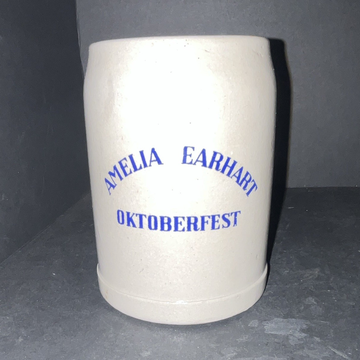 Amelia Earhart Oktoberfest 0.5L White Ceramic Beer Mug Stein Blue Text
